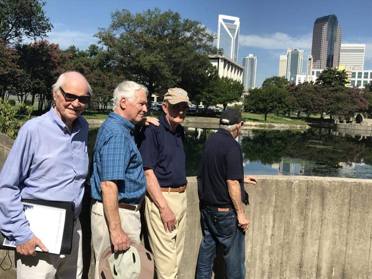 In 2017, Rolfe Neill worked to preserve green space in the Marshall Park area with development looming. Here, Neill is shown in August 2017 with, from left, architect Murray Whisnant, retired Duke Power CEO Bill Grigg and retired Bank of America CEO Hugh McColl.
