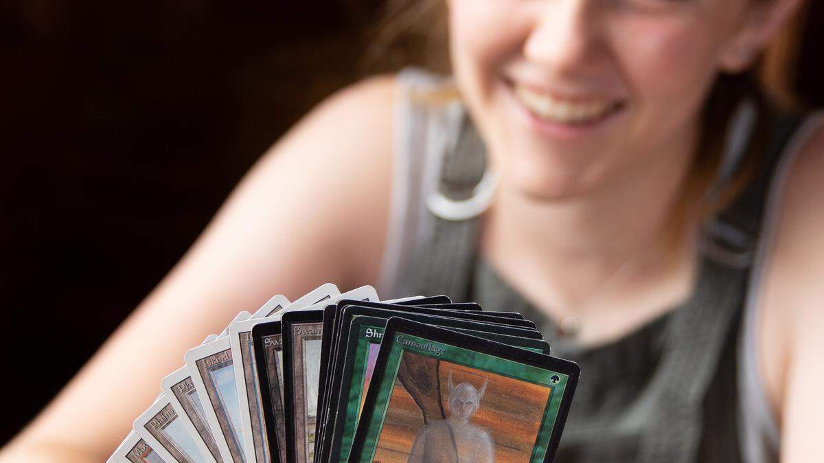 UNC-Chapel Hill student, Kess Hendrix, 21, excitedly fans out some of her Magic The Gathering playing cards.