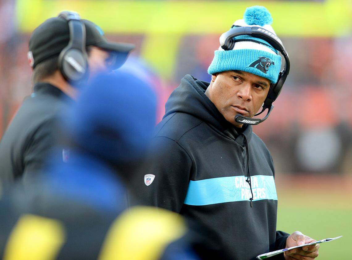Carolina Panthers defensive coordinator Eric Washington, right, glances over at head coach Ron Rivera, left, during late fourth quarter action against the Cleveland Browns on Sunday, Dec. 9, 2018 at FirstEnergy Stadium in Cleveland, Ohio. The Browns defeated the Panthers 26-20. (Jeff Siner/Charlotte Observer/TNS)