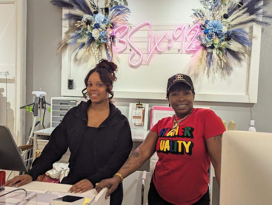 Jasmine Wright, left, owner of 3Six92, stands behind the register with employee Nikki Biggers. The store opened in August at Northlake Mall in Charlotte.