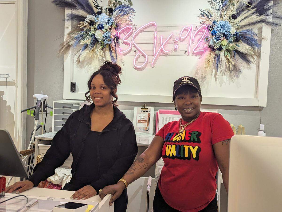 Jasmine Wright, left, owner of 3Six92, stands behind the register with employee Nikki Biggers. The store opened in August at Northlake Mall in Charlotte.
