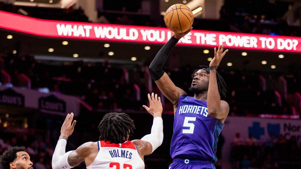 Charlotte Hornets center Mark Williams (5) shoots on Washington Wizards forward Richaun Holmes (22) during the second quarter at Spectrum Center.