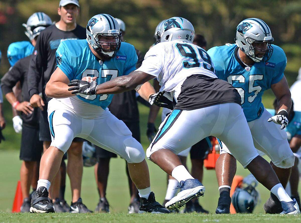 Carolina Panthers center Ryan Kalil (left) said the hardest thing to earn in the NFL is confidence, which provides the footing for everything else, including training camp battles against the likes of defensive tackle Kawann Short.