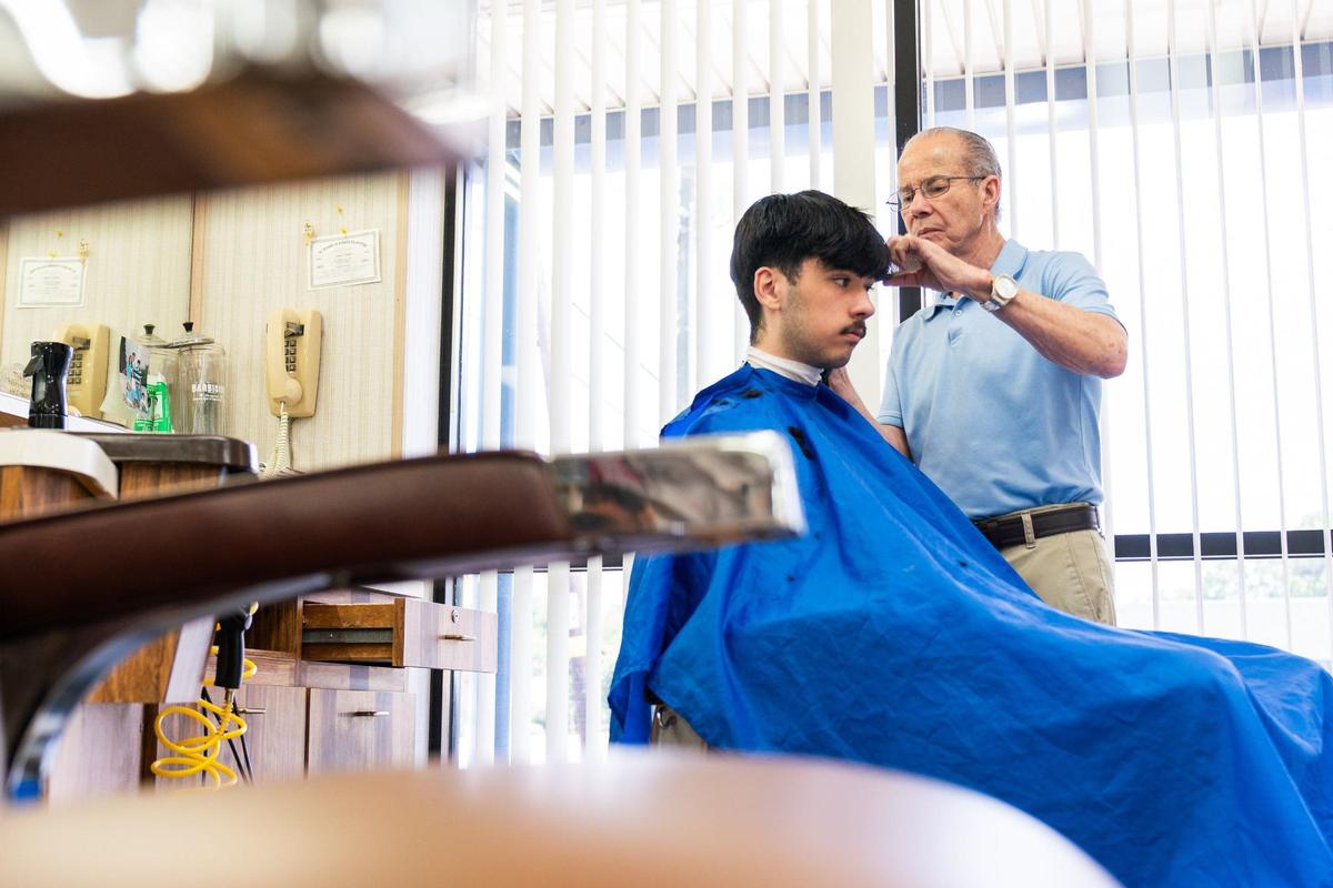 Gary Carter cuts Andrew Garcia’s hair on Wednesday. Garcia has been coming to Gary’s Barber Shop for three years now. At the end of the month, Carter is closing his barbershop at the end of the month; it’s been there for 59 years.