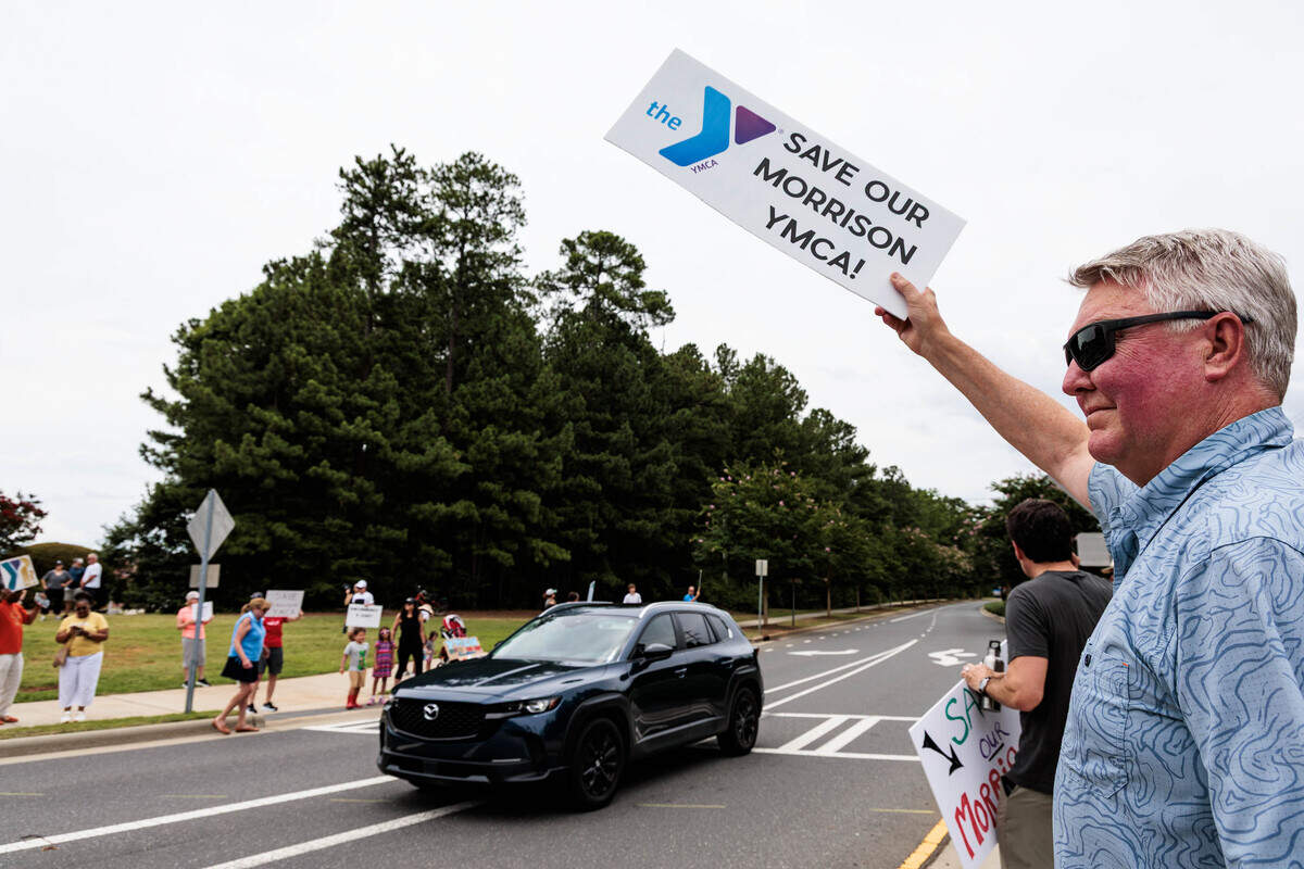 Cars honk at protesters outside the Morrison Family YMCA campus in Ballantyne on Sunday, July 12, 2026.