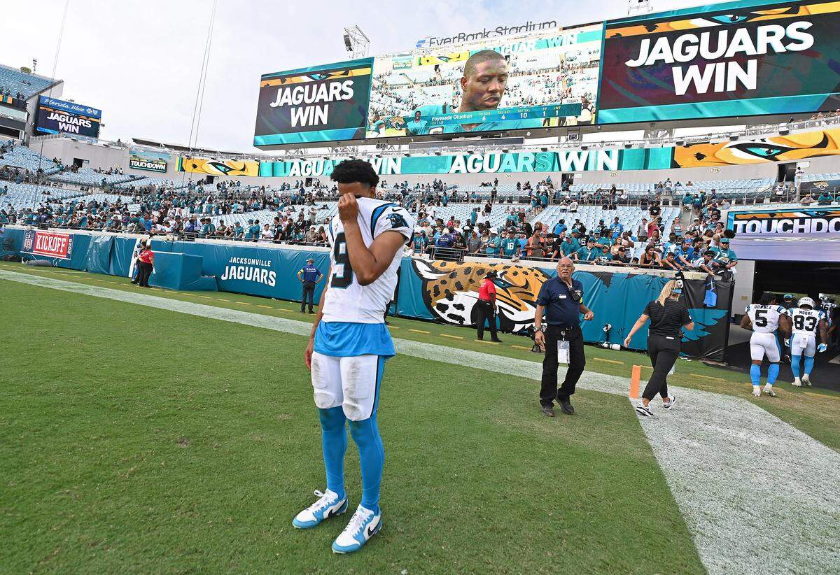 Carolina Panthers quarterback Bryce Young stands on the field waiting to embrace his teammates following the team’s 26-10 loss to the Jacksonville Jaguars on Sunday, September 7, 2025 at Everbank Stadium in Jacksonville, Florida.