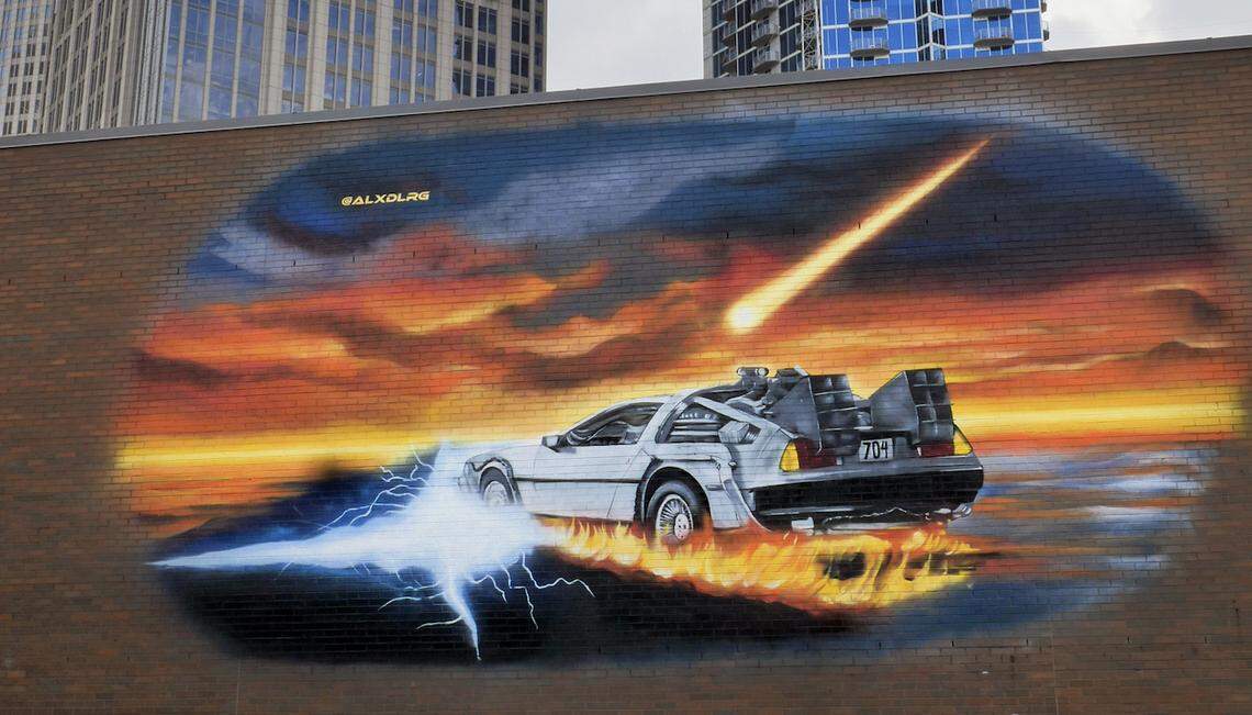 Alex DeLarge of Charlotte painted the DeLorean mural at Discovery Place as part of the Talking Walls project.