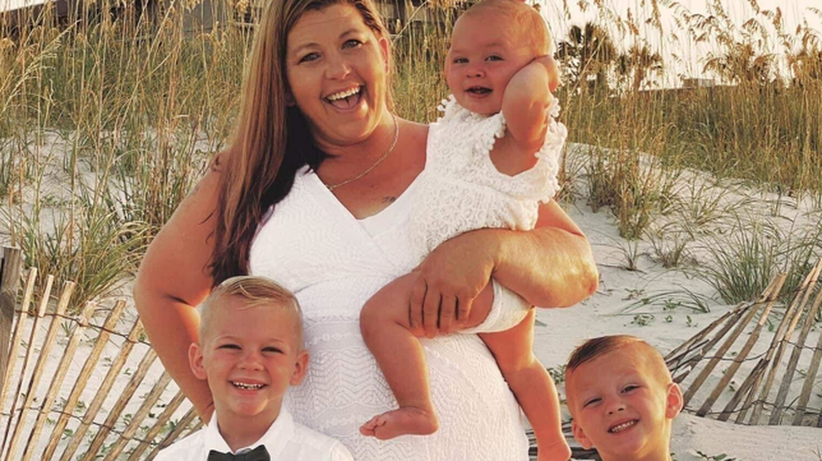 Karen Baker poses with her three grandchildren. She had three sons and one daughter, she was shot and killed early Wednesday morning July 13, 2022.