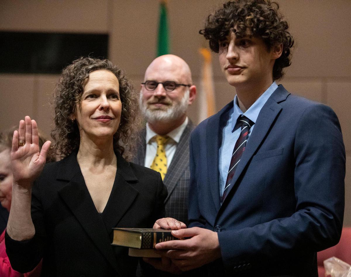 At-Large Commissioner Leigh Altman gets sworn in next to her family at the Charlotte-Mecklenburg Government Center Monday, Dec. 5 in Charlotte, NC.
