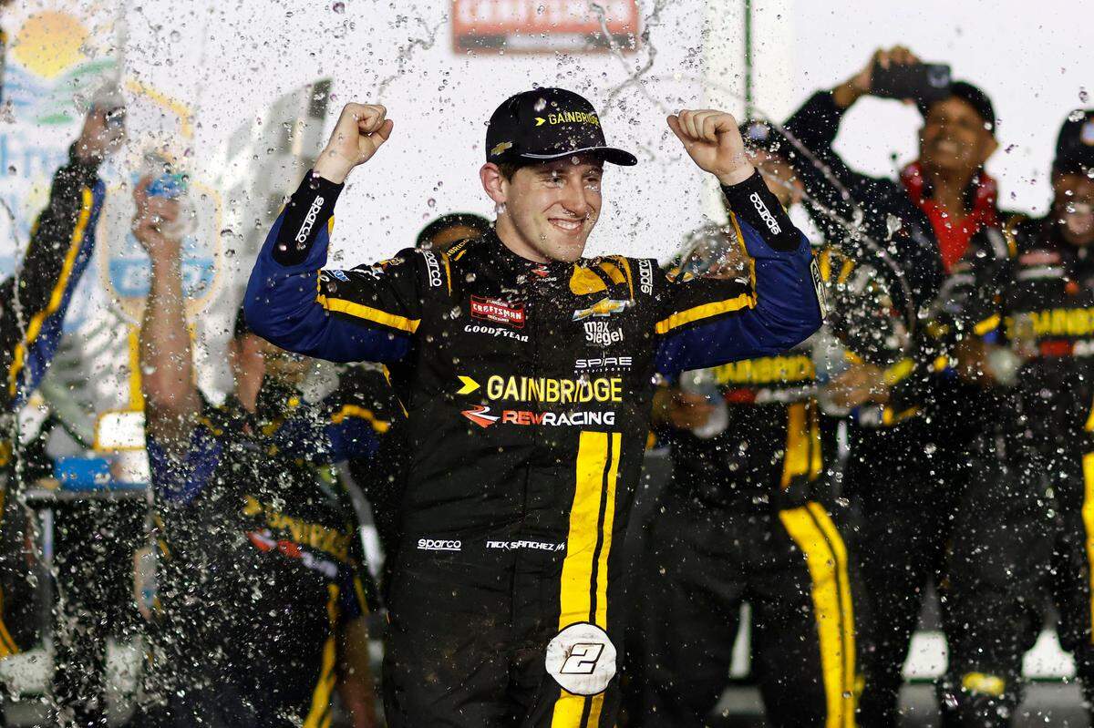 Feb 16, 2024; Daytona Beach, Florida, USA; NASCAR Truck Series driver Nick Sanchez (2) reacts in victory lane after winning the Fresh From Florida 250 at Daytona International Speedway.