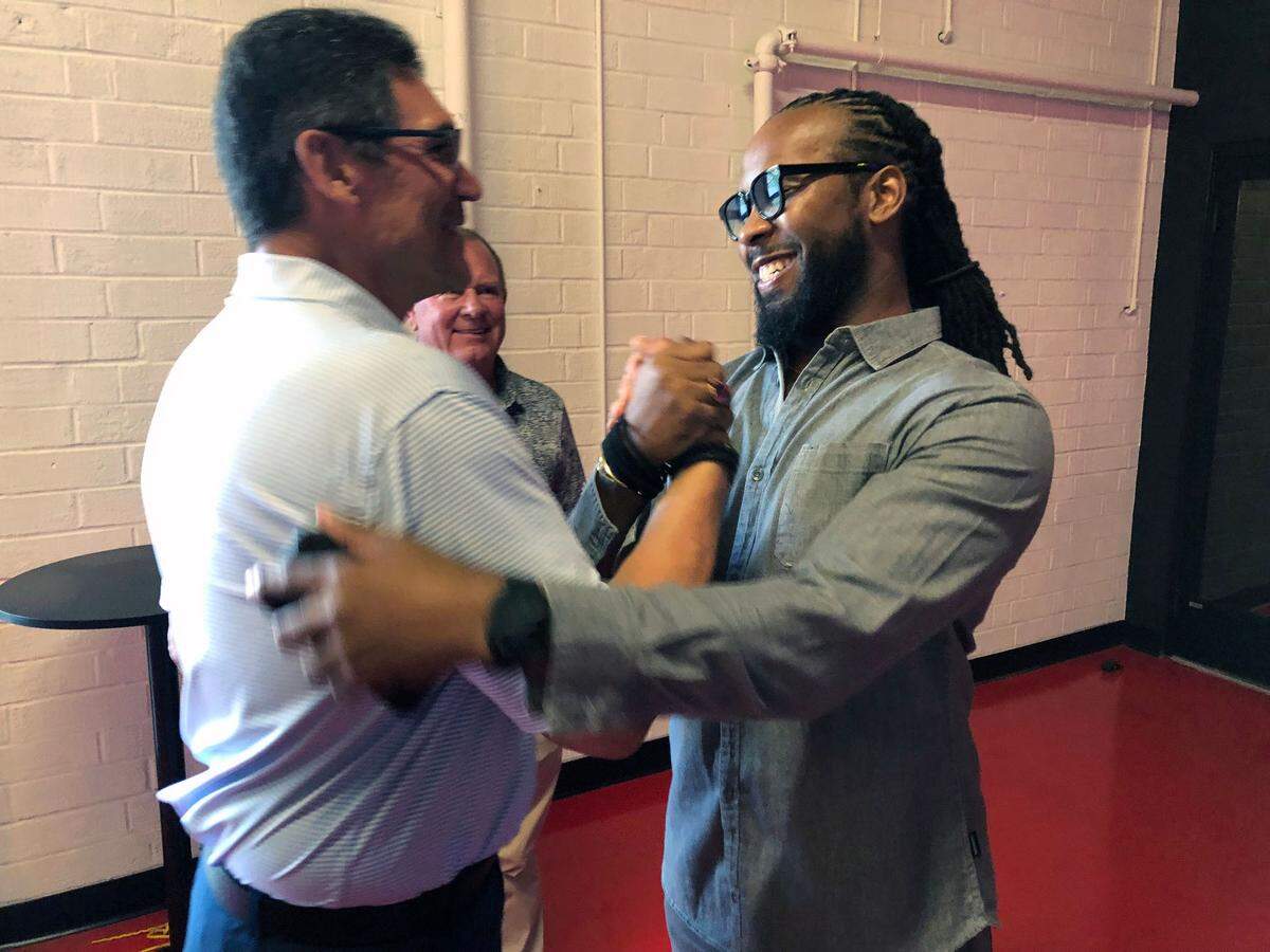 Former Carolina Panthers head coach Ron Rivera and cornerback Josh Norman greet one another at the Independent Picture House in Charlotte, NC on Thursday, July 24, 2025. The two were attending the premiere of The Charlotte Observer’s Super Men documentary.