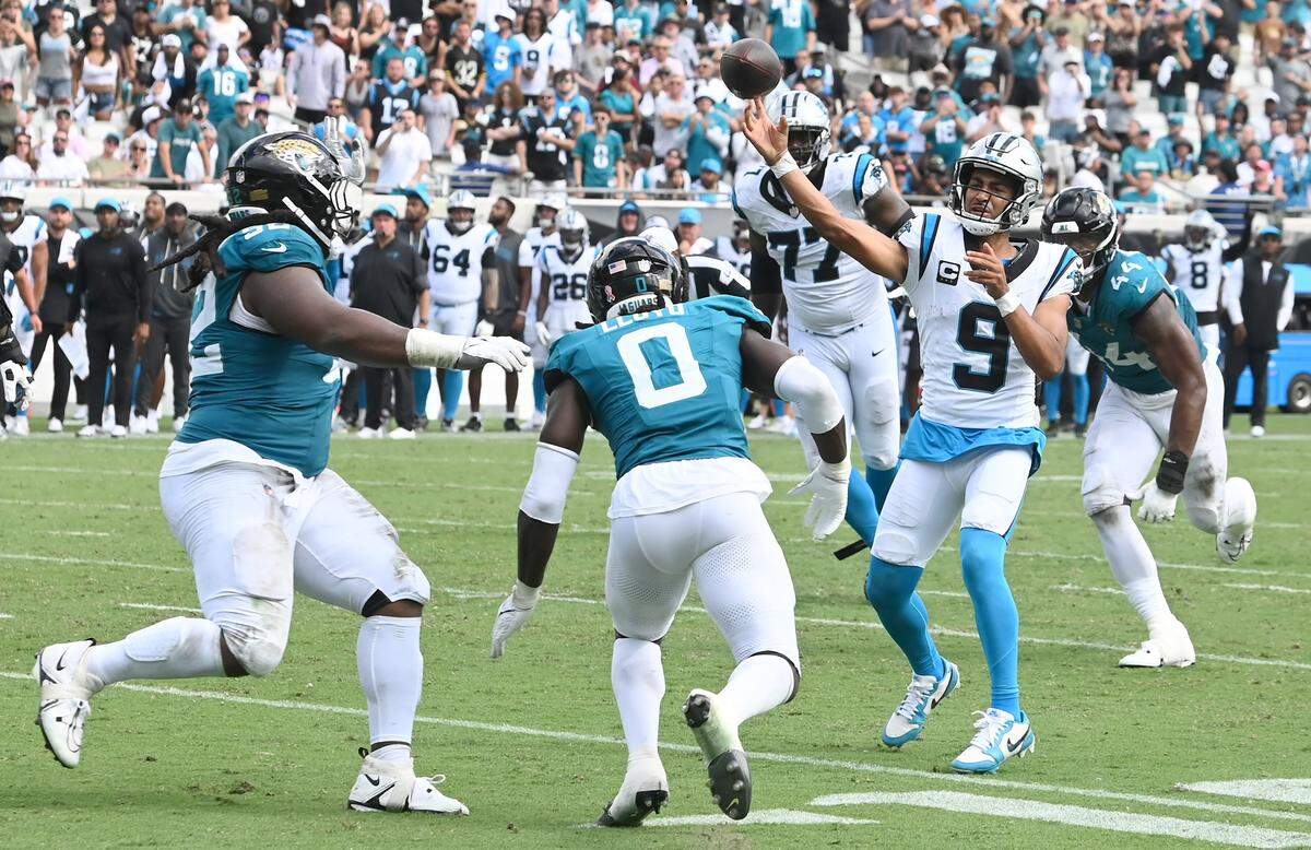 The Jacksonville Jaguars defense rushes Carolina Panthers quarterback Bryce Young as he attempts to throw a pass to one of two receivers in the end zone on fourth and five on Sunday, September 7, 2025 at Everbank Stadium in Jacksonville, Florida. The Jaguars defeated the Panthers 26-10.