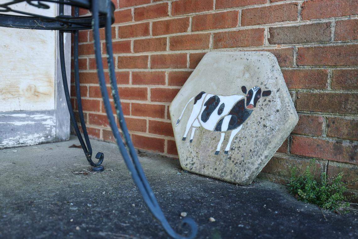 A dairy cow-decorated tile sits on the back patio of the main family house on Westmoreland Farm. As urban sprawl pressures the region, Westmoreland Farm, the last dairy farm in Mecklenburg, is selling.