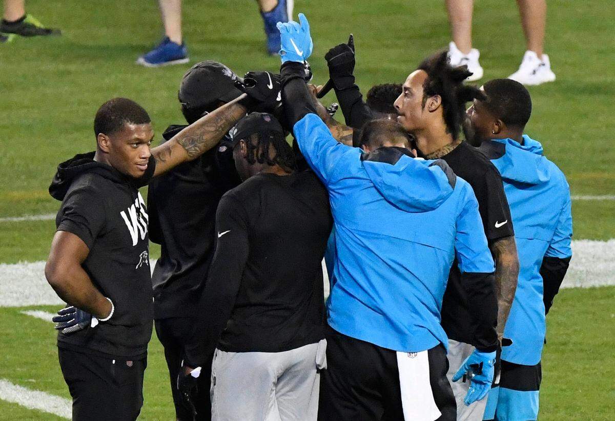 Members of the the Carolina Panthers huddle up prior warming up before playing the Atlanta Falcons in their Thursday Night Football game at Bank of America Stadium on Thursday, October 29, 2020.