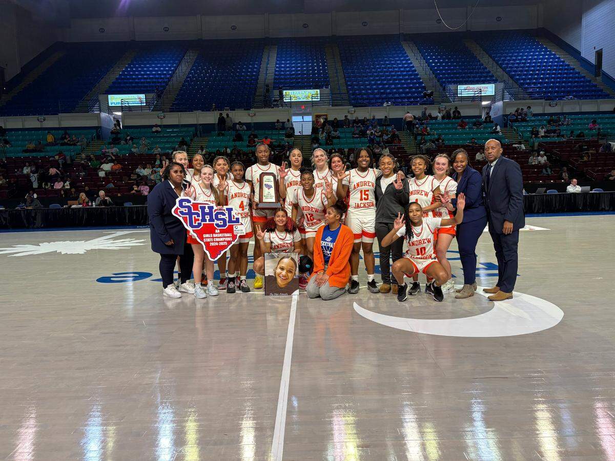 The Andrew Jackson girls’ basketball team poses for a team photo following its victory in the 2025 SCHSL 2A state championship Saturday in Florence.