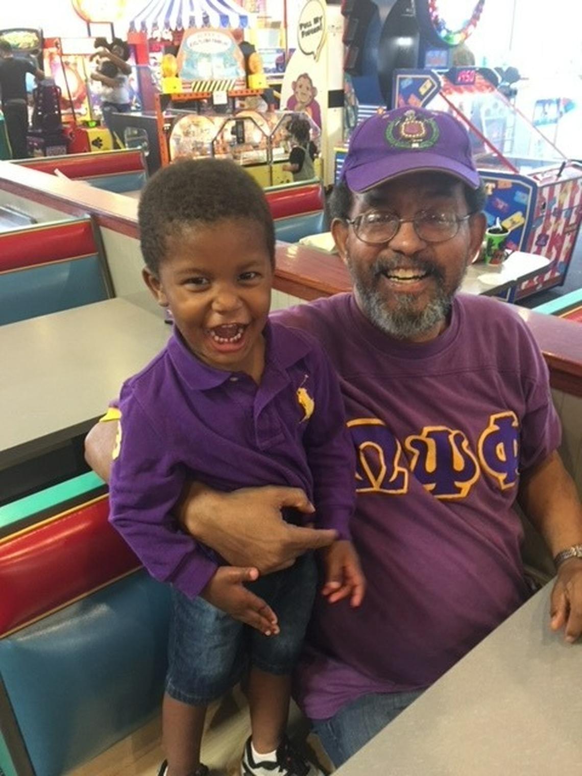 Melvin Pinn with his grandson, Leland Bingham.