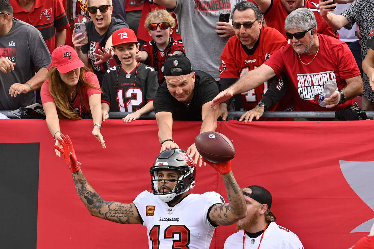 Tampa Bay Buccaneers wide receiver Mike Evans celebrates after scoring during the second half of an NFL football game between the Carolina Panthers and the Tampa Bay Buccaneers on Sunday, Jan. 1, 2023, in Tampa, Fla. (AP Photo/Jason Behnken)