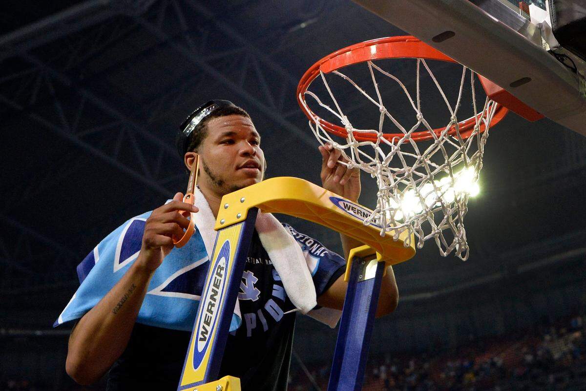 In an April 3, 2017 photo, Kennedy Meeks cuts down a part of the championship net after UNC beat Gonzaga in the NCAA national championship game.