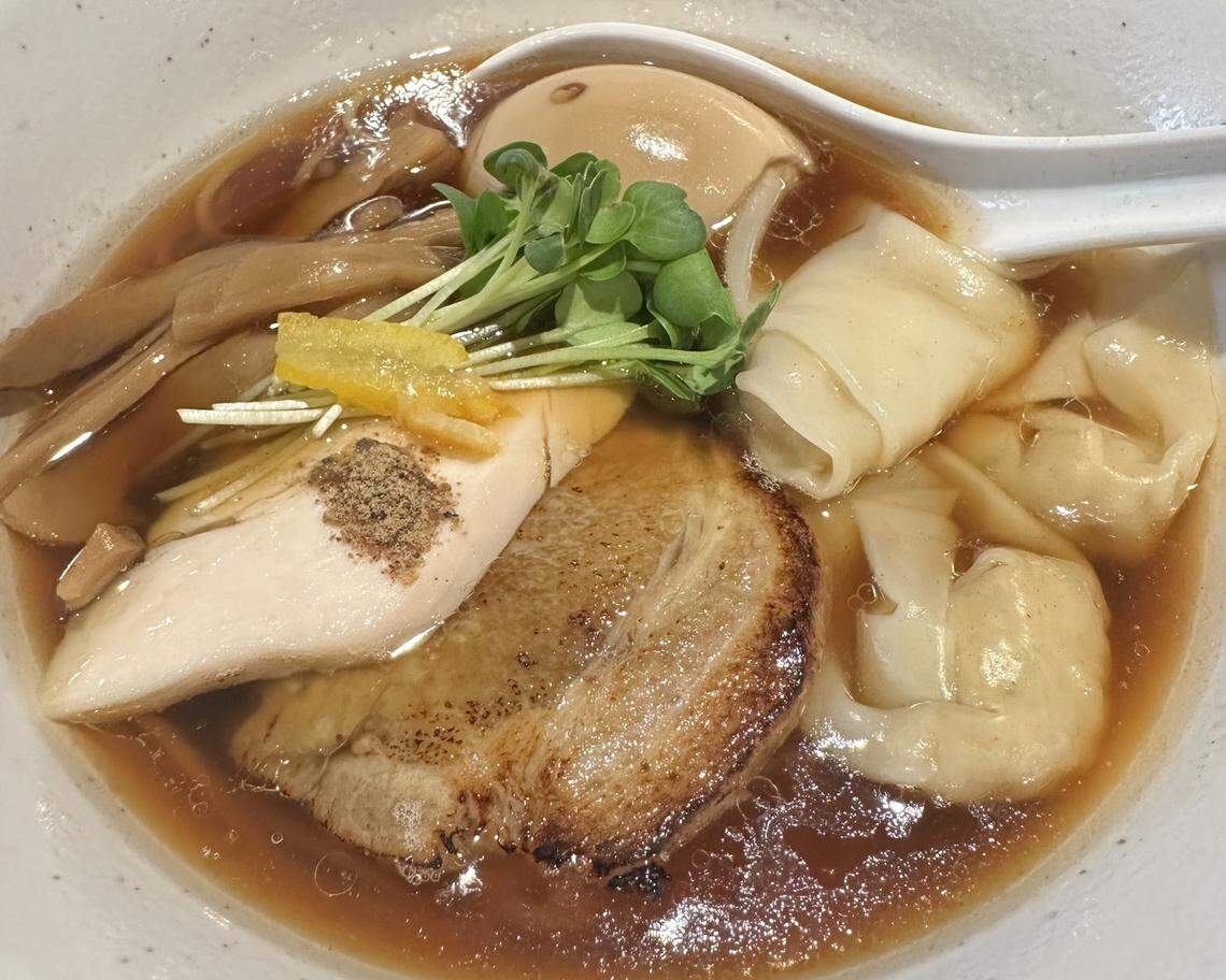 Shoyu ramen with a side of spicy daruma fermented chili sauce at Menya Daruma in Charlotte’s Dilworth neighborhood.