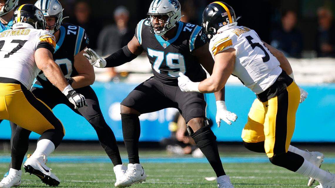 Carolina Panthers offensive tackle Brady Christensen (70) and Carolina Panthers offensive tackle Ikem Ekwonu (79) come off the line against Pittsburgh Steelers defense during a game at Bank of America Stadium in Charlotte, N.C., Sunday, Dec. 18, 2022.