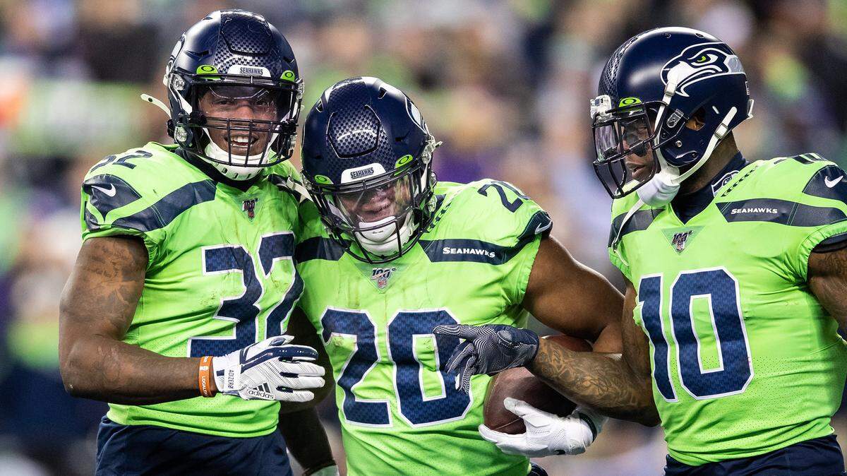 Seattle Seahawks running back Chris Carson (32), running back Rashaad Penny (20) and wide receiver Josh Gordon (10) celebrate Penny’s 13-yard touchdown during the second half against the Minnesota Vikings on Monday, Dec. 2, 2019 at CenturyLink Field in Seattle, Wash. (Andy Bao/Seattle Times/TNS)
