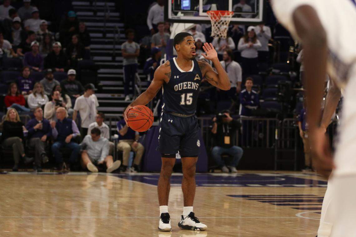 Kenny Dye, starting point guard and leading scorer for Queens University of Charlotte, directs the offense.