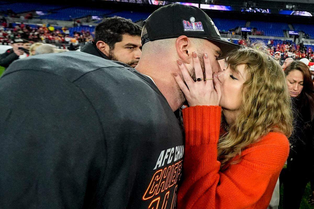 Taylor Swift kisses Kansas City Chiefs tight end Travis Kelce after an AFC Championship NFL football game against the Baltimore Ravens, Sunday, Jan. 28, 2024, in Baltimore. The Kansas City Chiefs won 17-10. (