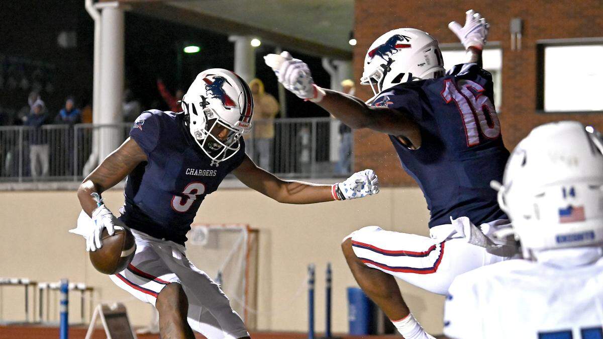 Providence Day wide receiver Jordan Shipp, left and Gordon Sellars, right, celebrate Shipp’s touchdown pass reception against Charlotte Christian during action on Friday, November 10, 2023.