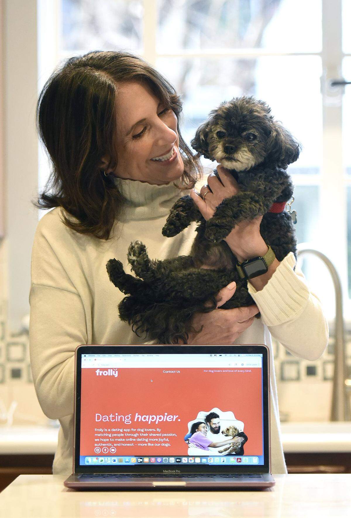 “I’m someone that hopes to bring the joy out in people,” says Cindy Himmel, shown here with her rescue dog Lulu, “and this entire dating app is based on the joy that our dogs bring.”