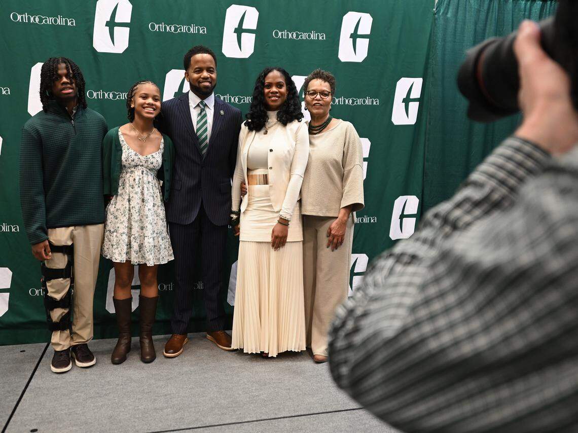 New Charlotte 49ers athletic director Kevin White, center, poses with members of his family Thursday. From left: 16-year-old son Kamden, 13-year-old daughter Kinley, wife Jari and mother Saundra.