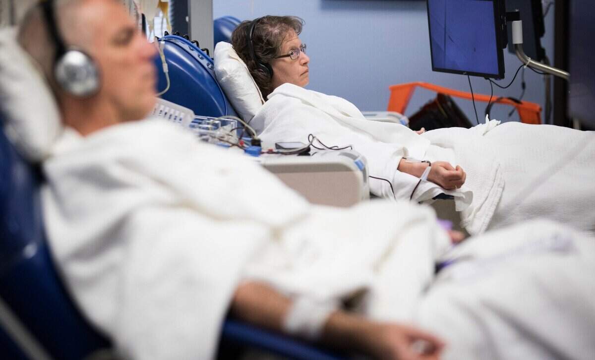 Paul Nelson, left, and Joy Beaston donate platelets at the American Red Cross in Cary, NC on Monday, March 9, 2020. In the Charlotte area, Red Cross officials say the dwindling number of blood donors and a post-holiday COVID-19 surge have affected blood supplies.