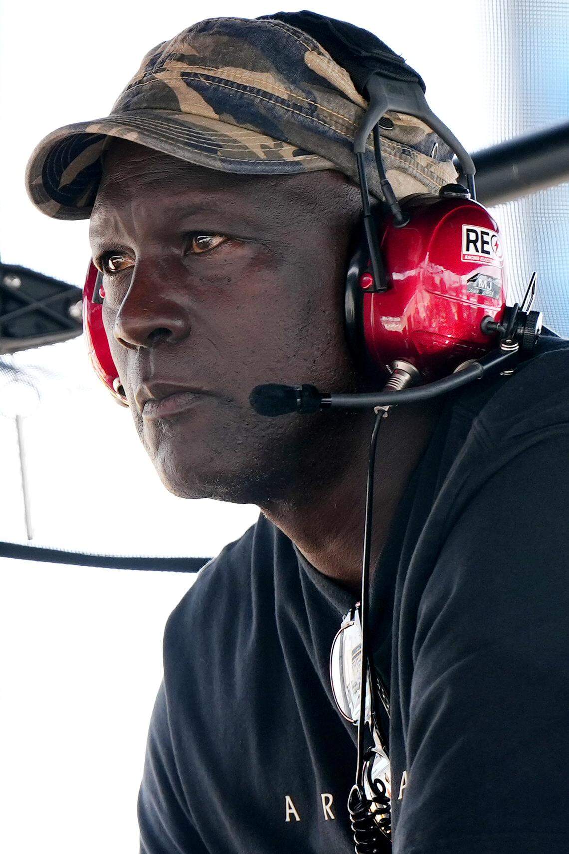 23XI Team co-owner Michael Jordan sits atop of the pitbox at Homestead-Miami Speedway. 