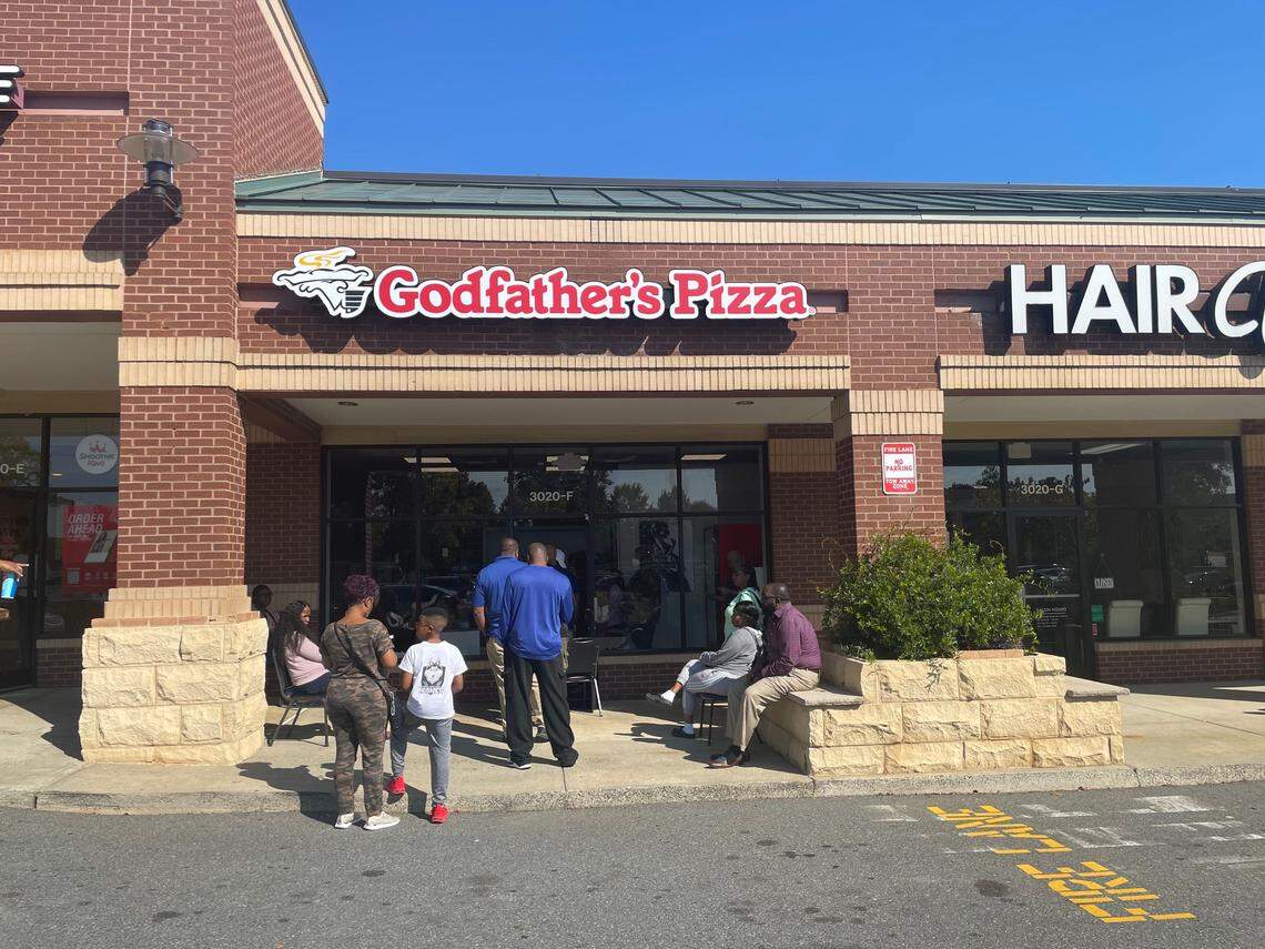 A line outside of Godfather’s Pizza on Monday, Oct. 17.