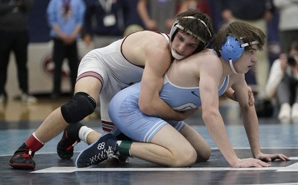Metrolina Christian's Gavin Ulrich, top, readies to start the second period against Charlotte Latin's Jack Gilson in their 138-pound championship match Saturday at the N.C. Independent Schools Athletic Association's state championships in Charlotte. BY BILL KISER/SPECIAL TO THE OBSERVER