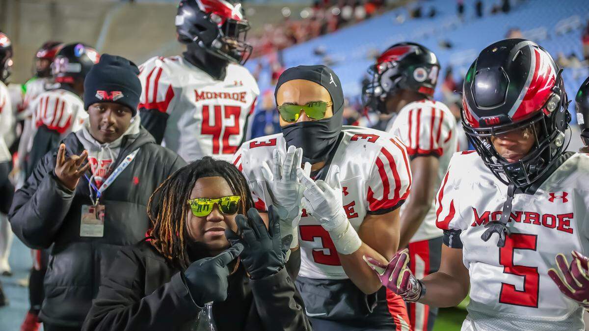 Monroe Redhawk teammates pose for a picture after defeating Northeastern in the NCHSAA 2A final at Kenan Stadium in Chapel Hill on Dec 21st, 2024