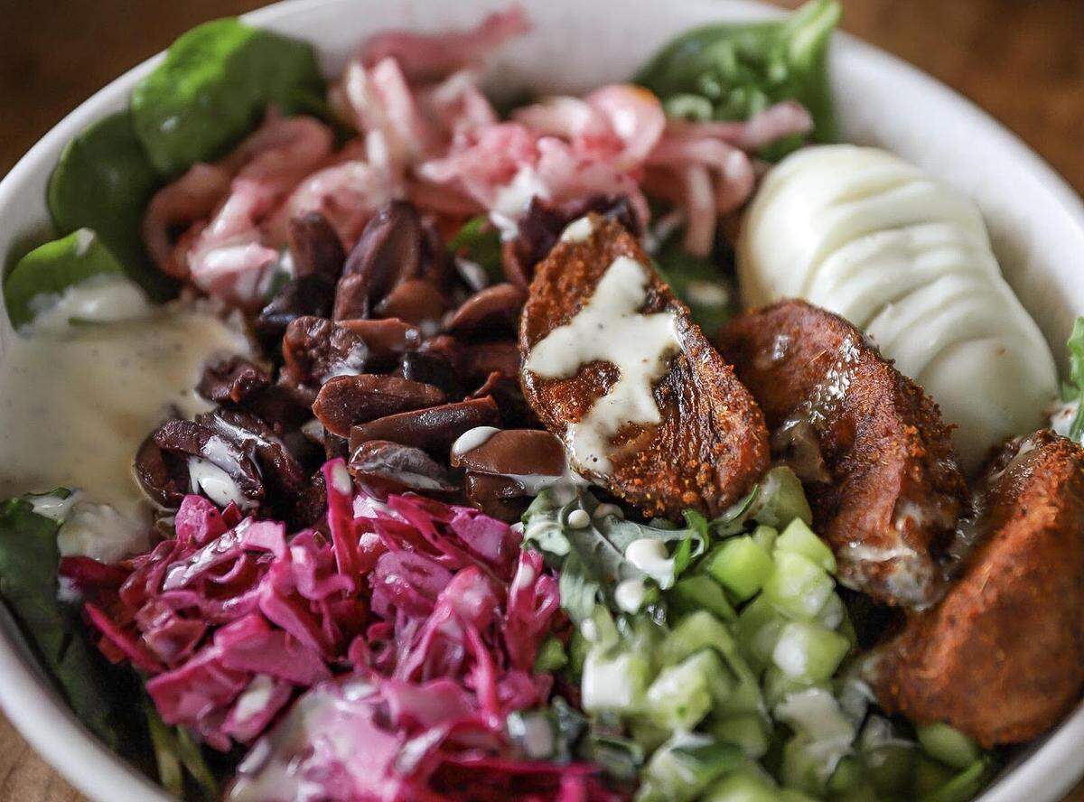 Diners can customize a bowl at Yafo Kitchen (starting at $8.99) to meet their needs.