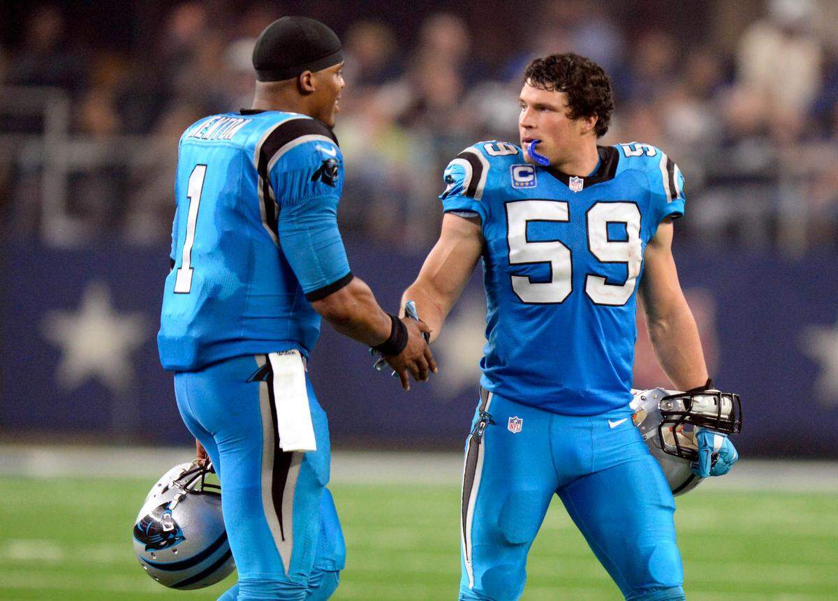 The Carolina Panthers’ Cam Newton (1) and Luke Kuechly (59) slap hands during their Thanksgiving Day 2015 win over Dallas in 2015.
