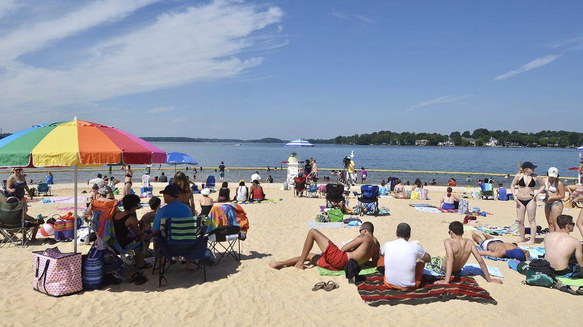 Hundreds of people flocked to the brand new beach on Lake Norman in Ramsey Creek Park.