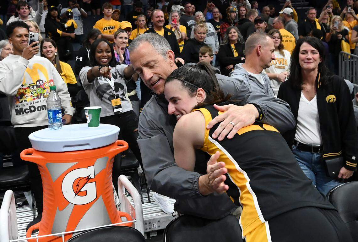 Brent Clark, left, hugs his daughter Caitlin Clark, right following Iowa’s victory over Virginia Tech 80-76 in the Ally Tipoff on Thursday, November 9, 2023 at Spectrum Center in Charlotte, NC.