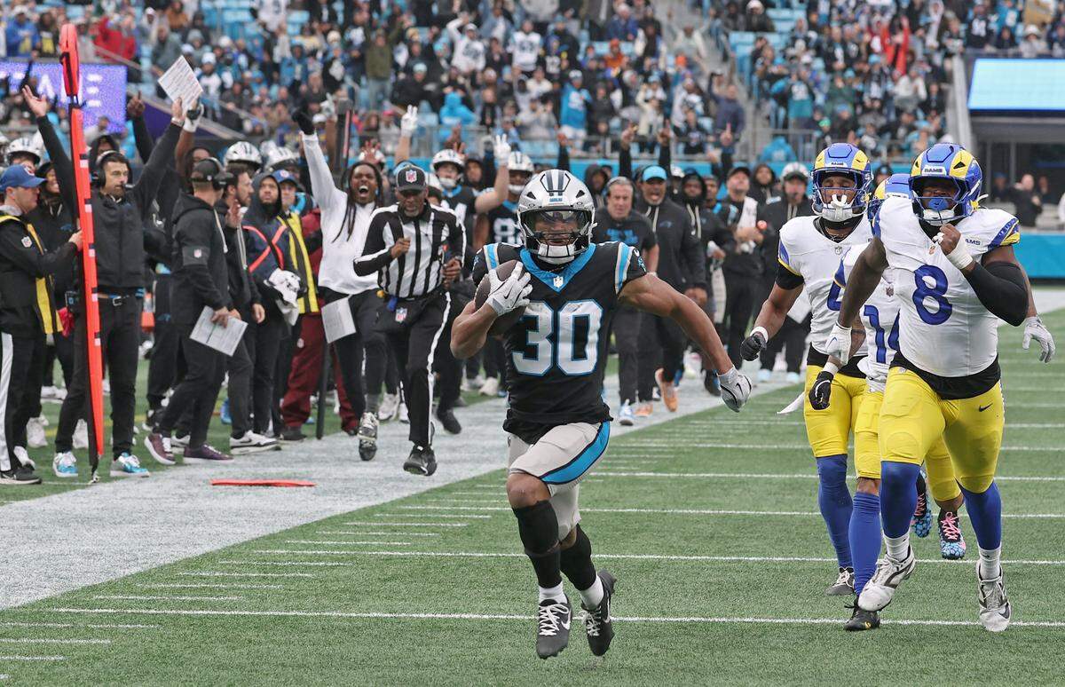 Carolina Panthers running back Chuba Hubbard breaks free of the Los Angeles Rams defense for a touchdown during action at Bank of America Stadium in Charlotte, NC on Sunday, November 30, 2025. The Panthers defeated the Rams 31-28.