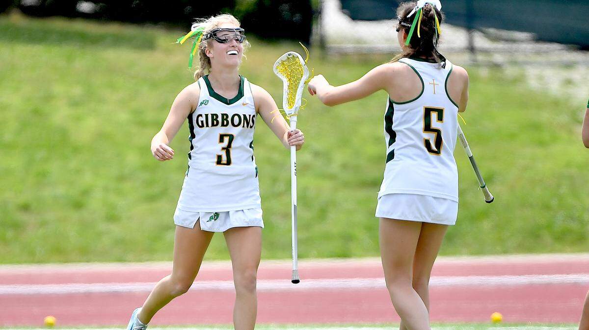 Cardinal Gibbons’ Chloe Tupis (3) celebrates her first-half goal against Weddington with Jane Bailey Ward in the NCHSAA 4A lacrosse championship game in Durham, N.C. on May 31, 2025.