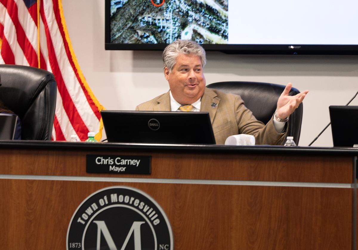 Mooresville Mayor Chris Carney speaks during a town commissioners meeting in Mooresville, North Carolina, on Oct. 6, 2025. He called votes to kill the I-77 South toll lanes shortsighted and a disappointment to the Charlotte region.