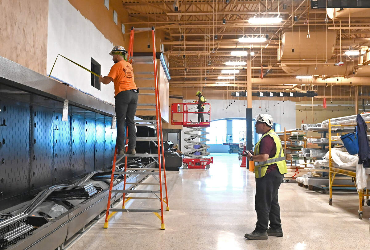 Work continues Thursday, May 21, 2026, on the Wegmans store opening Oct. 14 in Charlotte. In the center section of the store is a hole in the wall where Casanova, an animatronic rooster, will make its appearance to crow on the hour.