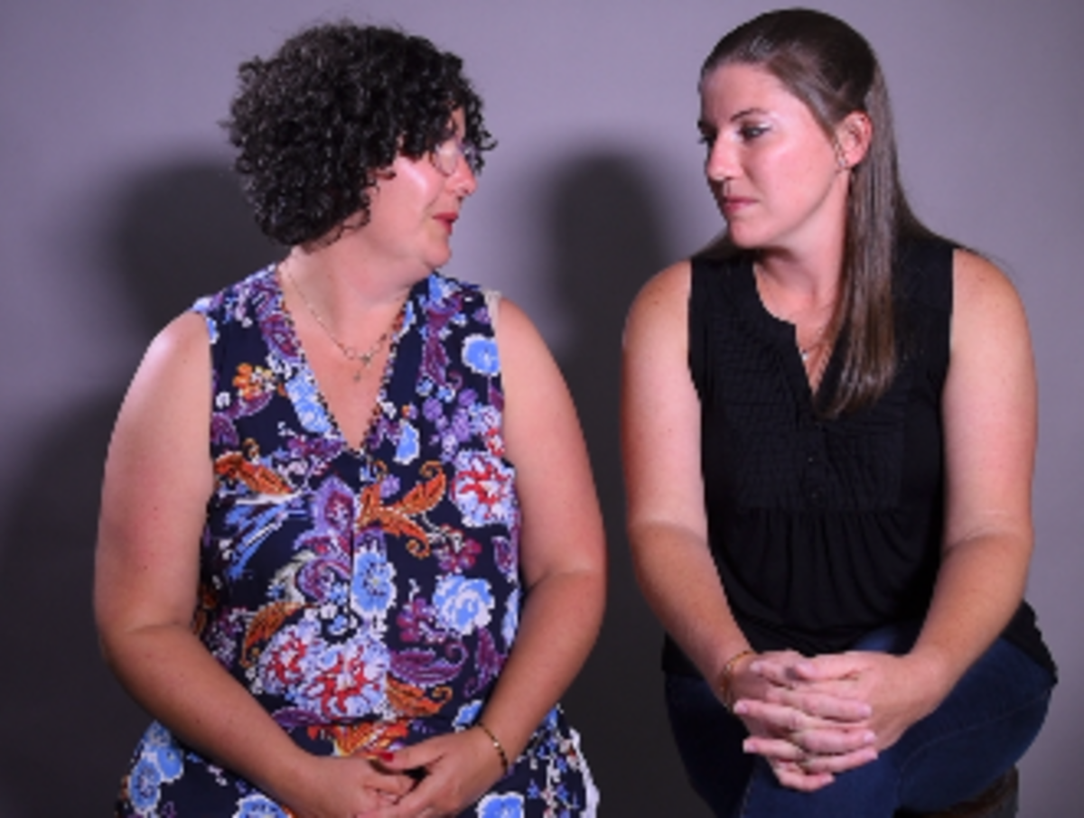 “To feel like you finally have a voice is very empowering,” said Amanda Johnson (right, pictured here with her sister, Miracle Balsitis), after learning that Pastor Chuck Wilson removed the photo of her father from a wall at Matthews United Methodist Church..