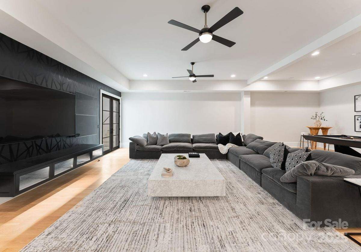 A living area is shown in Shaq Thompson’s south Charlotte mansion.