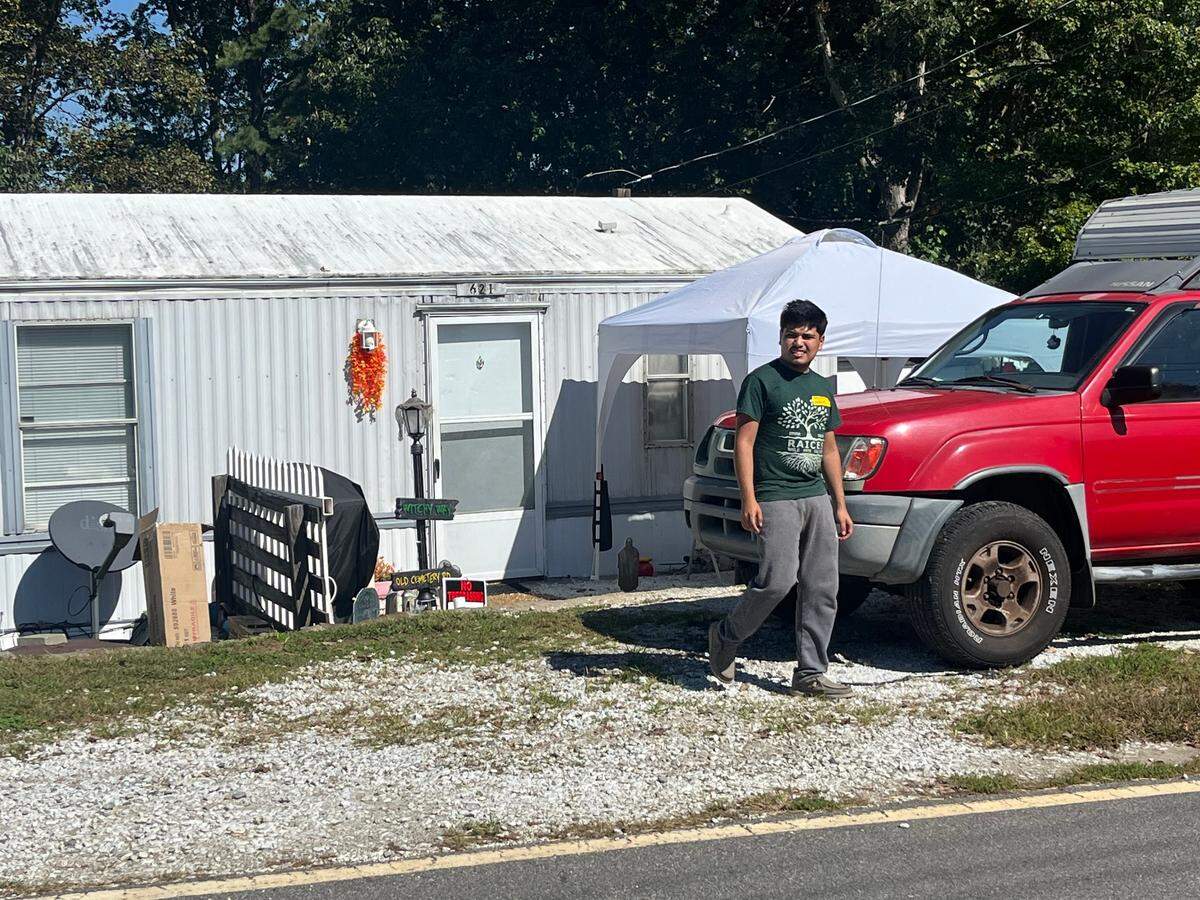 Diego Romero walks through a neighborhood in Emma and checks on community members, asking what supplies they need. He lives there, and he says his neighbors would do the same for him.