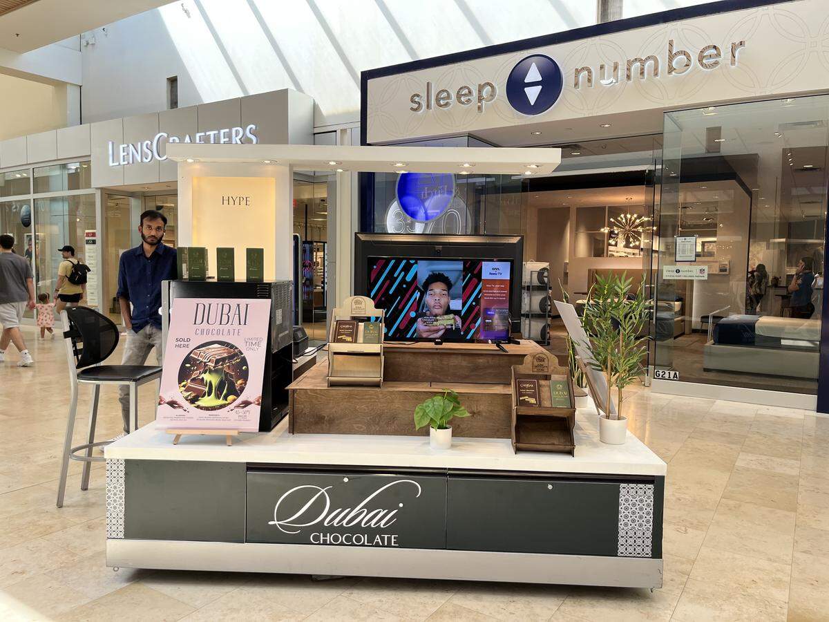 A Dubai Chocolate kiosk at SouthPark Mall sits right in front of the Sleep Number store.