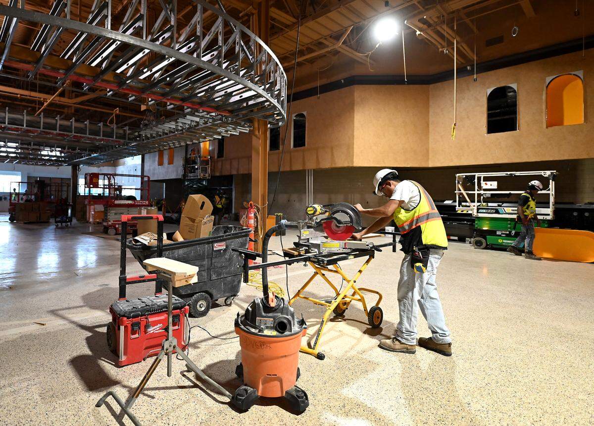 Work continues on the new Ballantyne Wegmans store on Thursday, May 21, 2026. The new store will feature a sushi bar with an awning in the cafe entrance area, shown.