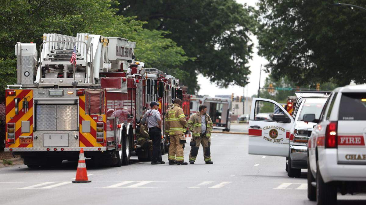 Fire fighters work the scene at a massive fire is burning in Charlotte’s South Park neighborhood Thursday morning.