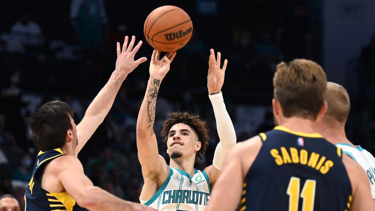 Charlotte Hornets guard LaMelo Ball, center, is making 66.7% of his 3-pointers through two games this season.